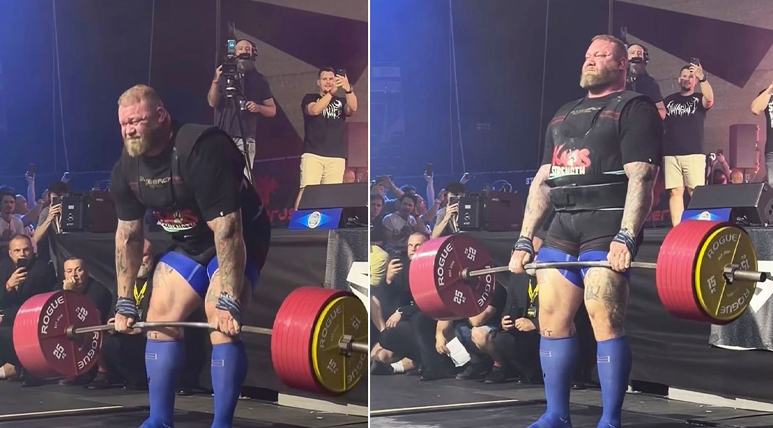 Hafthor Bjornsson executa deadlift com barra carregada de placas de 20 kg, pés firmes e postura baixa