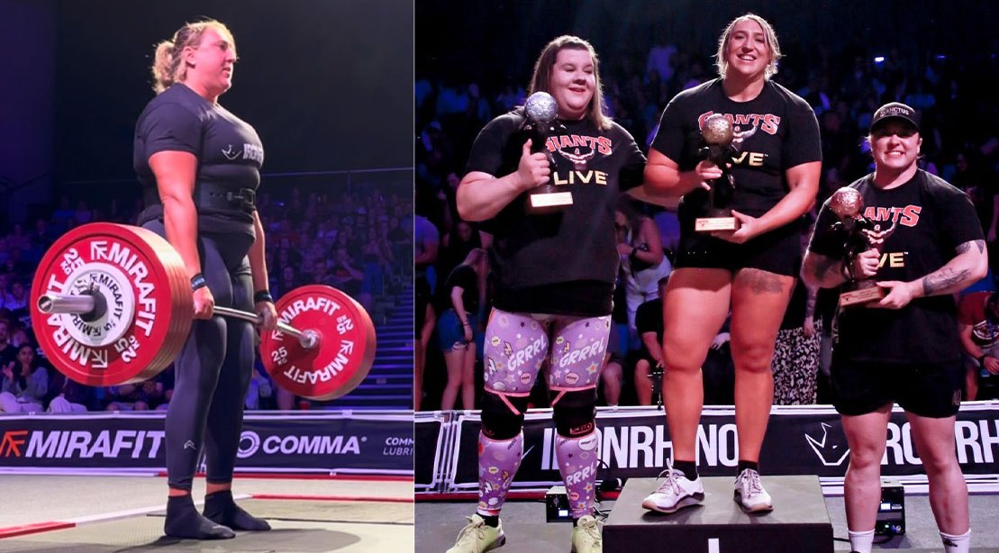 Lucy Underdown levanta barra pesada em arena, vestindo macacão azul, com kettlebells e cronômetro ao fundo