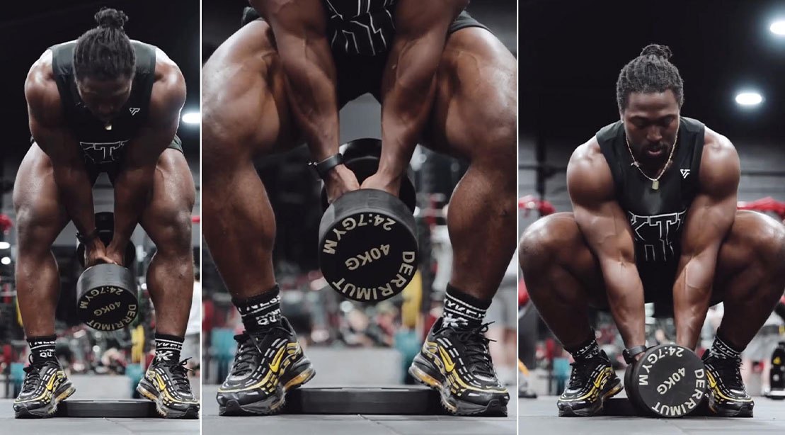 Atleta executa Somersault Squat com kettlebell acima da cabeça, mostrando quadríceps tensionados e movimento de rotação